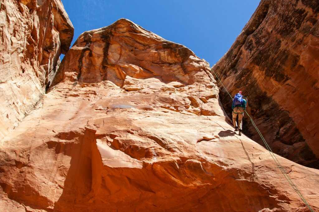 a person climbing a rock wall